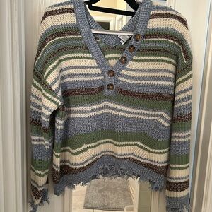 V-neck distressed bottom sweater